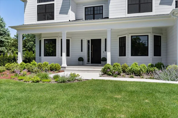front view of a house with a yard