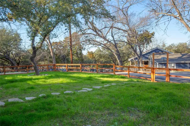 a bedroom with a bed and a night stand