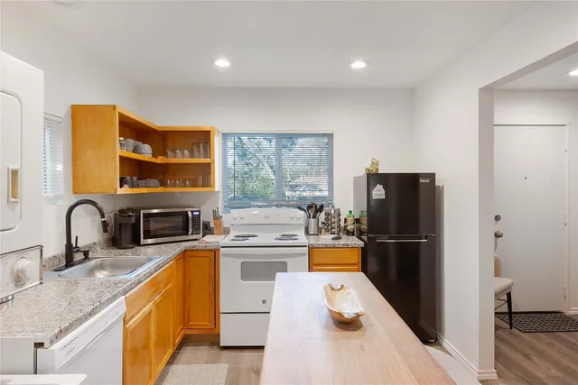 a view of a chair and table in the balcony