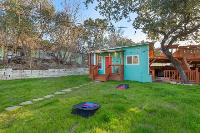 a backyard of a house with seating fountain