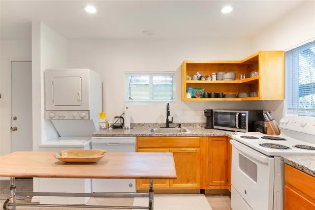 a view of a bedroom with window and ceiling fan