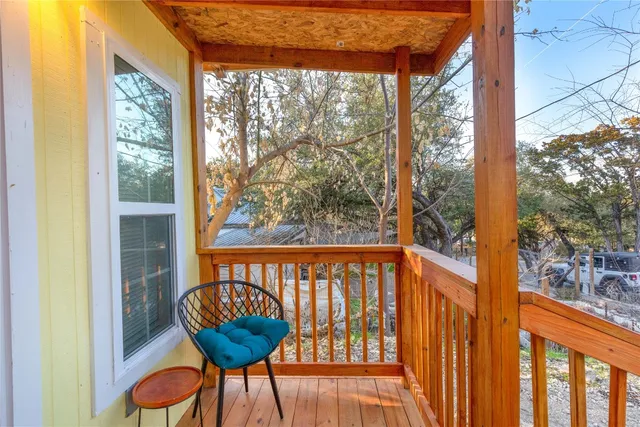 a kitchen with a sink a stove and a wooden cabinets