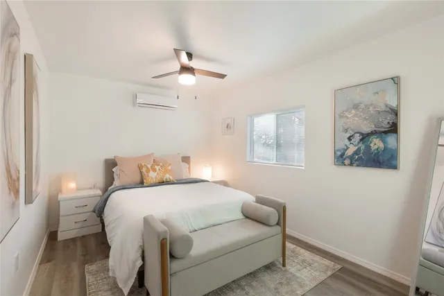a kitchen with a refrigerator and a stove top oven