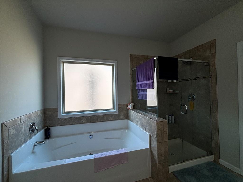 3459 In Bloom Way Auburn, GA 30011 - Photo 25 of 35 a bathroom with a bathtub and a shower