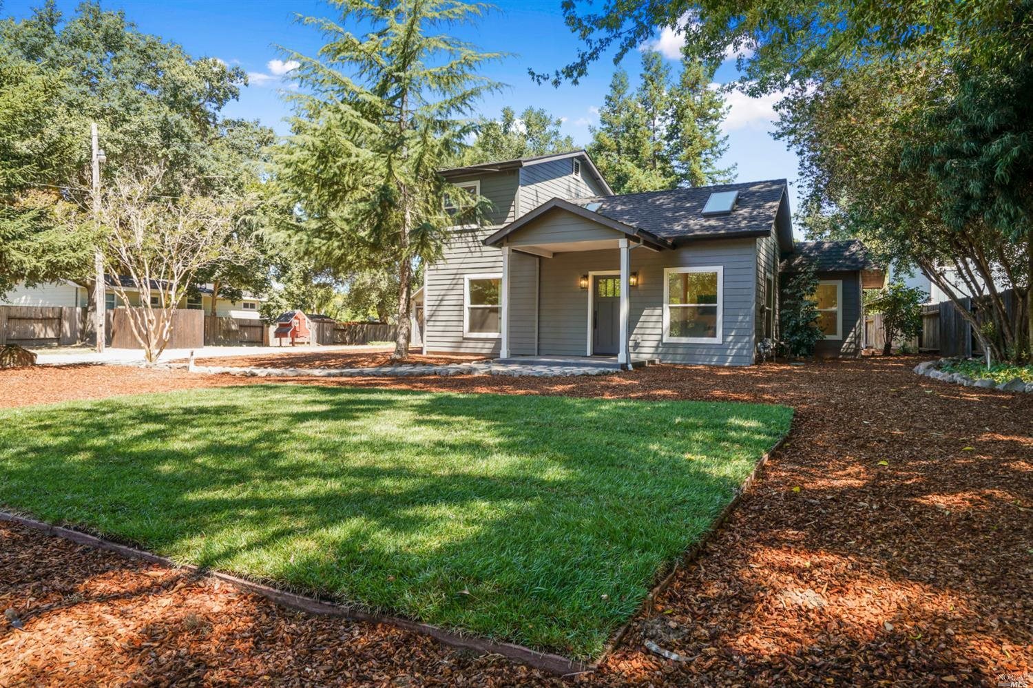 a front view of a house with a yard