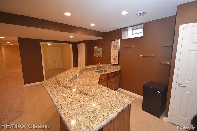 27458 Cromwell Road Novi, MI 48374 - Photo 32 of 39 Custom built wet bar with granite counter tops.