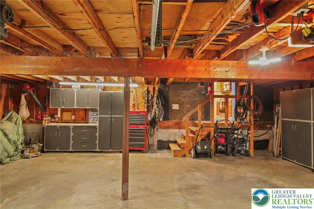 3470 Brodhead Road Bethlehem, PA 18020 - Photo 72 of 84 Functional garage with ample storage cabinetry and workbenches, ideal for projects.
