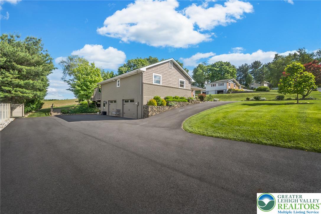 540 Briar Road Pen Argyl, PA 18072 - Photo 3 of 66 wide paved driveway ,attached garage, circular drive in front