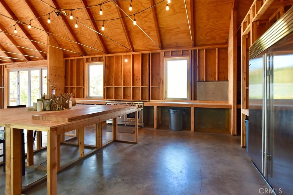 0 Old Creek Road Templeton, CA 93465 - Photo 18 of 26 a large kitchen with stainless steel appliances wooden floor and a view of living room