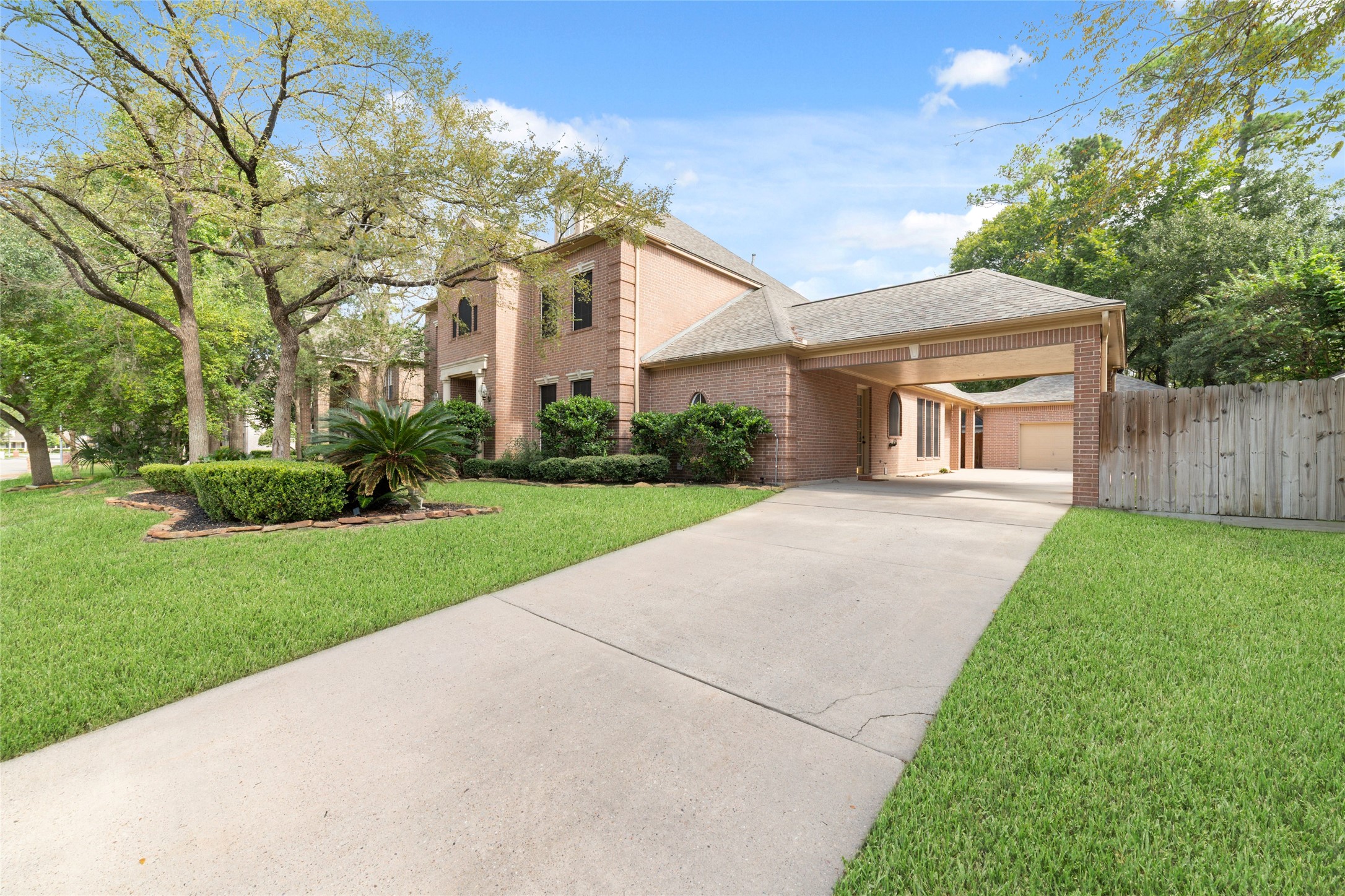 16114 Lafone Drive Spring, TX 77379 - Photo 39 of 45 Extended driveway leads to the porte-cochere and detached garage.