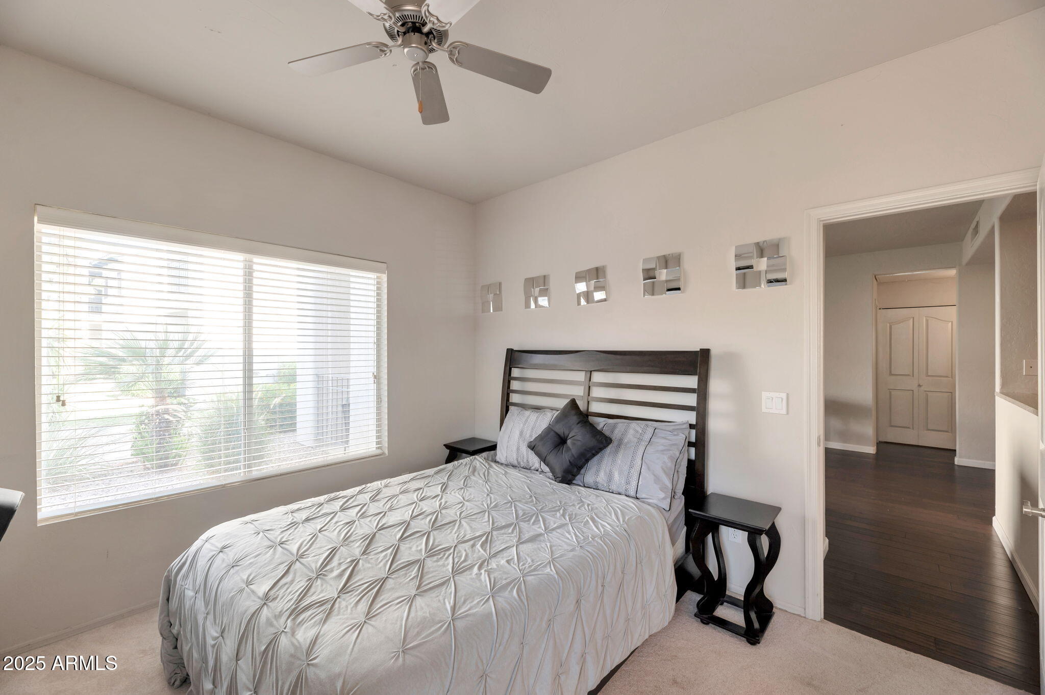 14145 North 92nd Street, Unit 1051 Scottsdale, AZ 85260 - Photo 11 of 21 a bedroom with a bed and a window