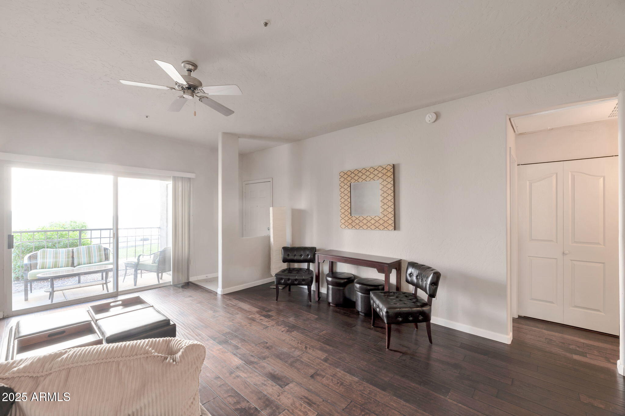 14145 North 92nd Street, Unit 1051 Scottsdale, AZ 85260 - Photo 18 of 21 a living room with furniture and large windows