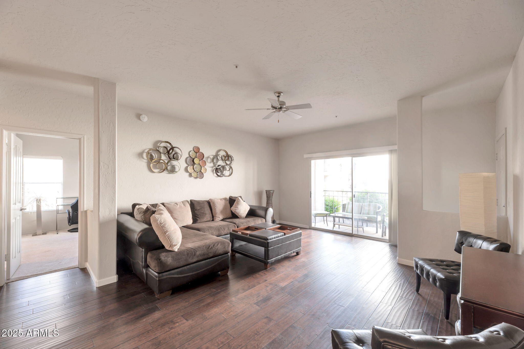 14145 North 92nd Street, Unit 1051 Scottsdale, AZ 85260 - Photo 19 of 21 a living room with furniture and wooden floor