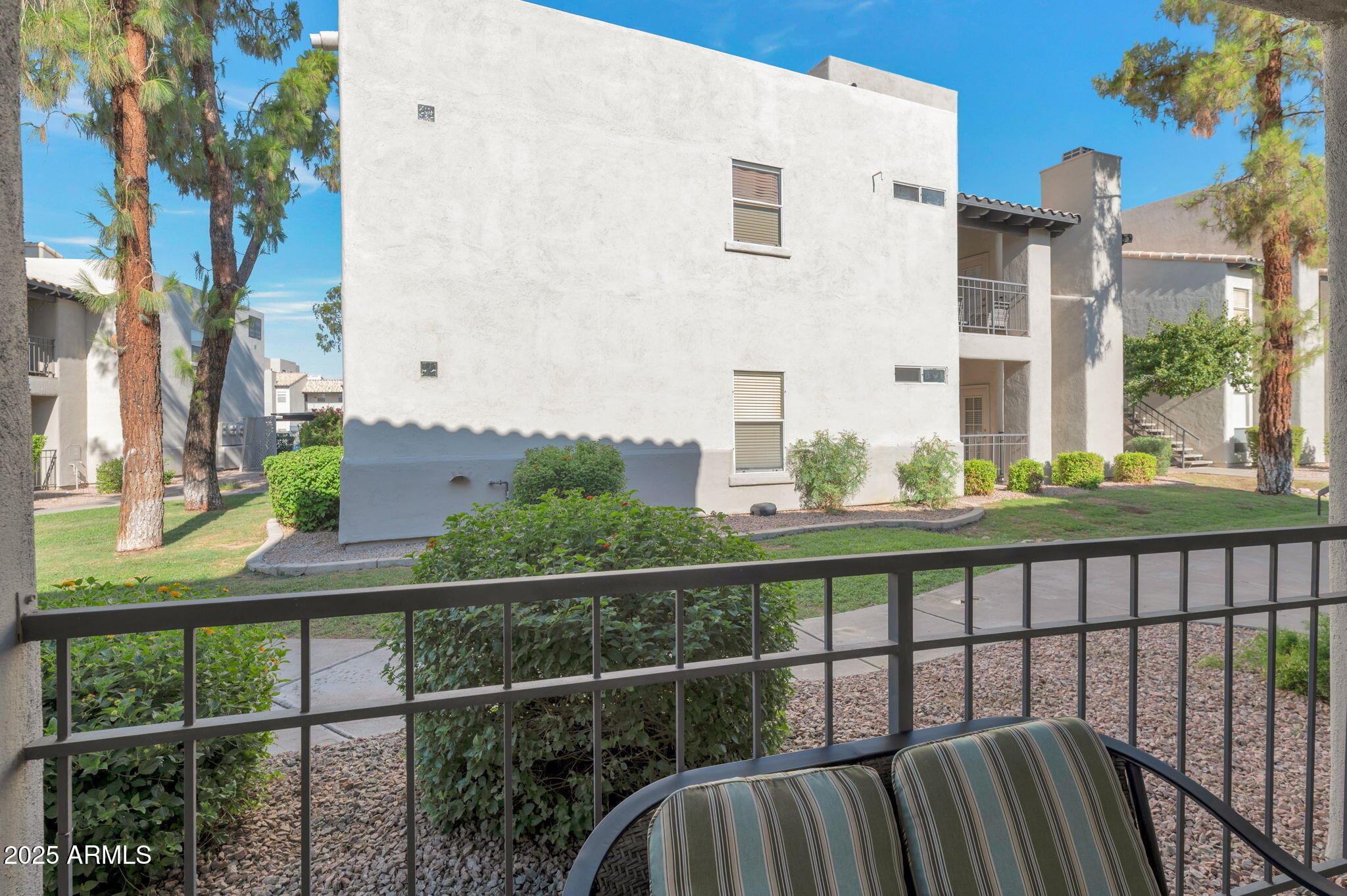 14145 North 92nd Street, Unit 1051 Scottsdale, AZ 85260 - Photo 8 of 21 a view of a building from a balcony