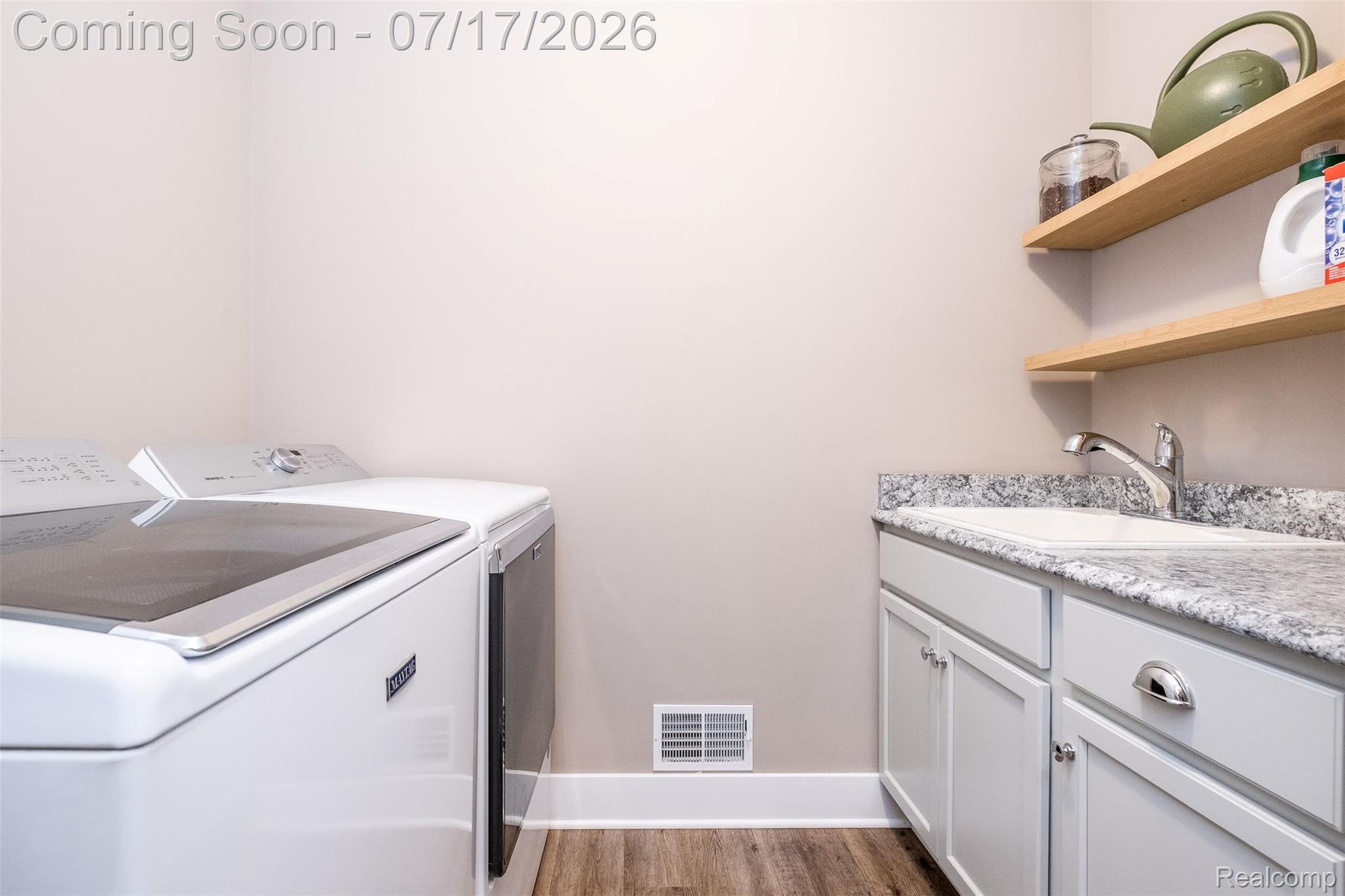 12349 Sugar Maple Drive Fenton, MI 48430 - Photo 21 of 67 Dedicated laundry area featuring wood-finish flooring, light grey walls, and white baseboards