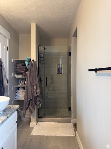 7481 Red Pine Road Eagle Mountain, UT 84005 - Photo 24 of 38 Glass-enclosed shower with subway tile surround and integrated shower niche