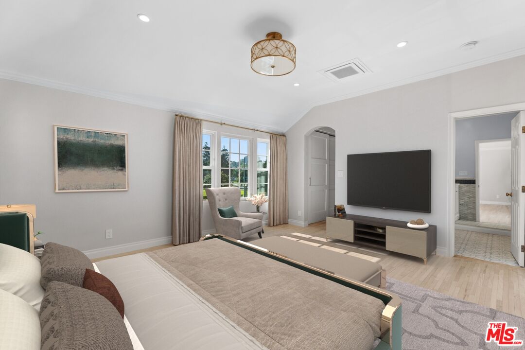 9683 West Olympic Boulevard Beverly Hills, CA 90212 - Photo 14 of 20 a bedroom with a bed and a flat screen tv