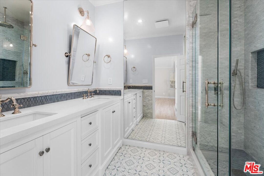 9683 West Olympic Boulevard Beverly Hills, CA 90212 - Photo 15 of 20 a spacious bathroom with a double vanity sink mirror and shower