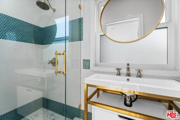 a bathroom with a sink and a mirror