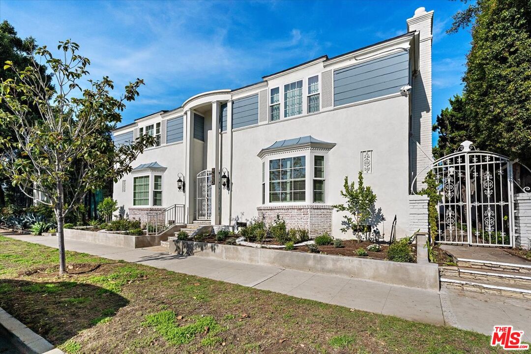 9683 West Olympic Boulevard Beverly Hills, CA 90212 - Photo 20 of 20 a front view of a house with entertaining space