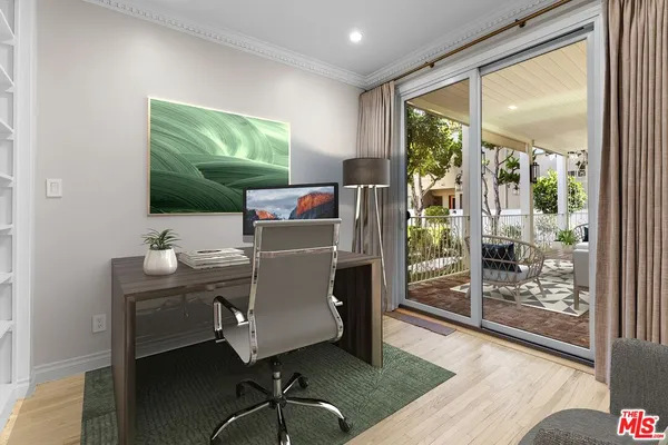 a work room with furniture and a window