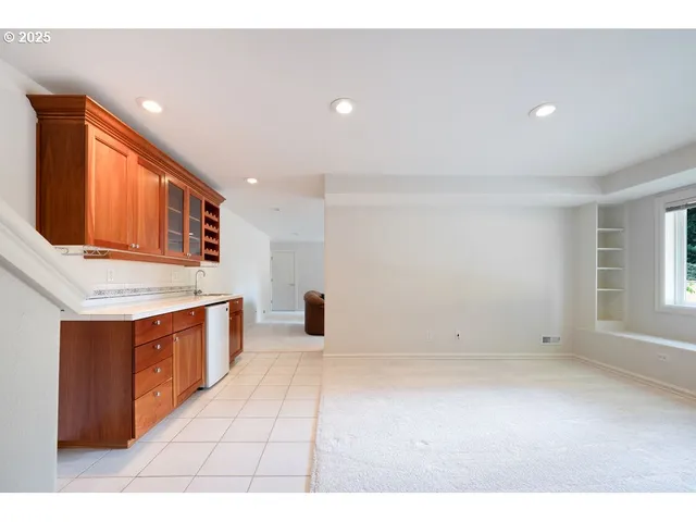 a kitchen with stainless steel appliances granite countertop a sink and cabinets