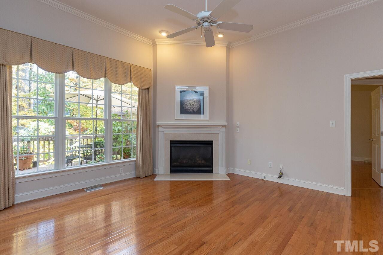 7382 Fontana Ridge Lane Raleigh, NC 27613 - Photo 12 of 30 a view of an empty room with a window and wooden floor