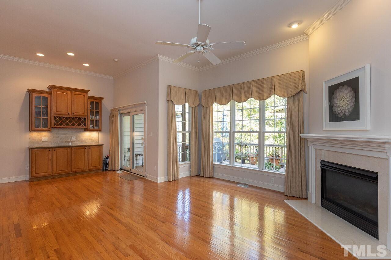 7382 Fontana Ridge Lane Raleigh, NC 27613 - Photo 13 of 30 a view of a kitchen with a stove cabinets and wooden floor