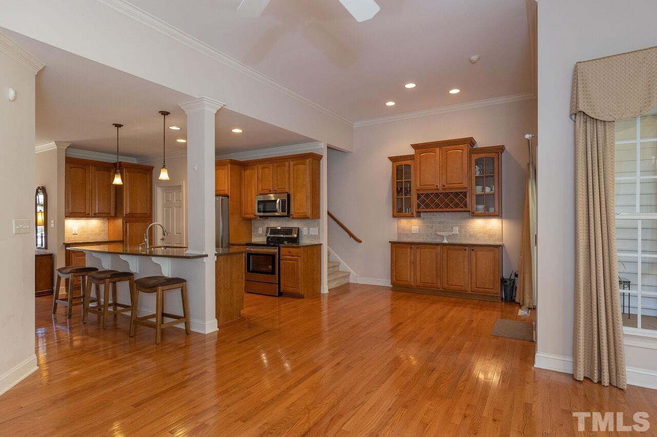 7382 Fontana Ridge Lane Raleigh, NC 27613 - Photo 14 of 30 a kitchen with stainless steel appliances a refrigerator and a stove top oven