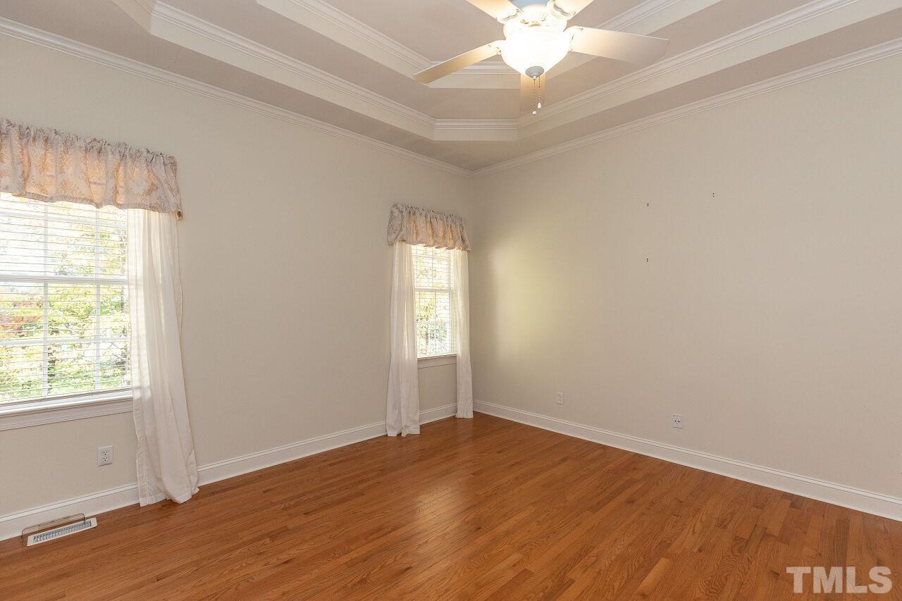 7382 Fontana Ridge Lane Raleigh, NC 27613 - Photo 15 of 30 an empty room with wooden floor and windows