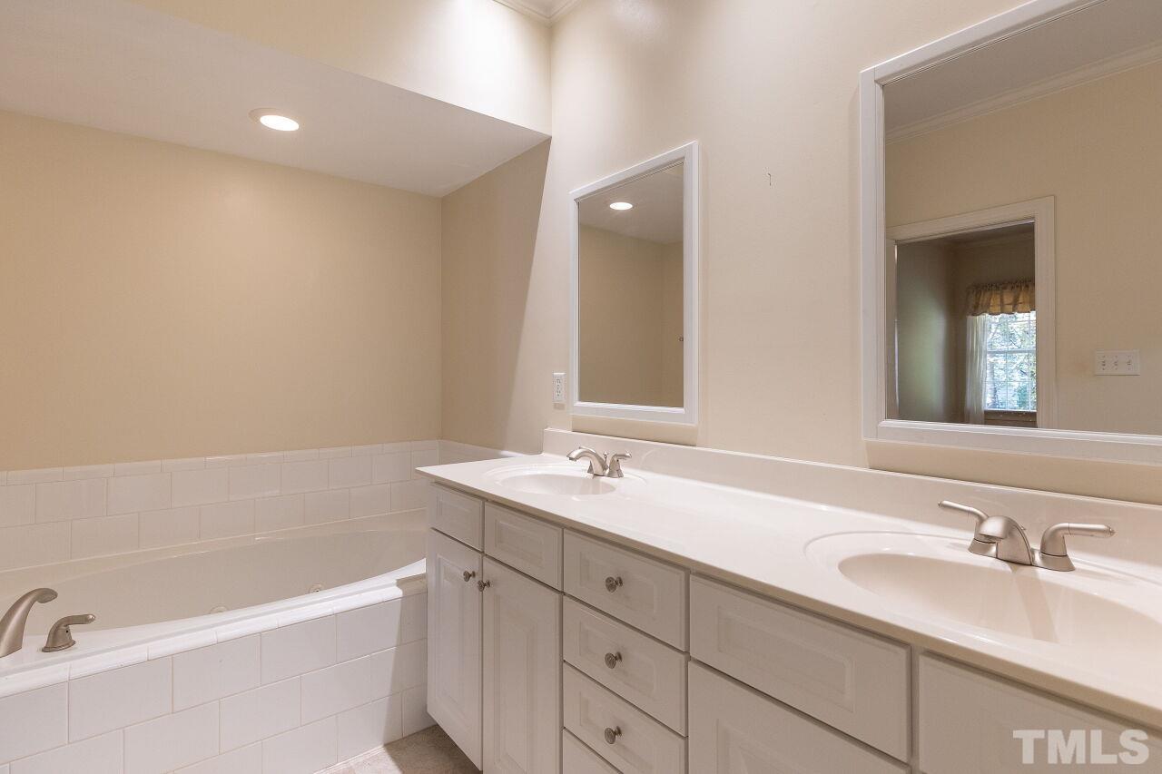7382 Fontana Ridge Lane Raleigh, NC 27613 - Photo 18 of 30 a bathroom with a sink and a bathtub