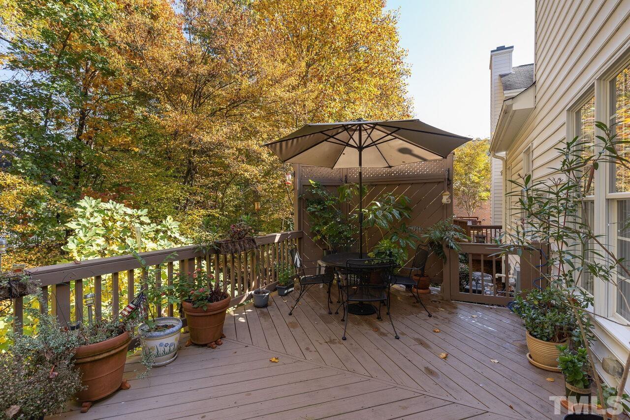 7382 Fontana Ridge Lane Raleigh, NC 27613 - Photo 27 of 30 a view of a deck with furniture and barbeque oven