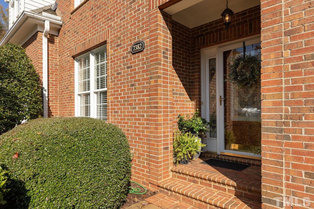 7382 Fontana Ridge Lane Raleigh, NC 27613 - Photo 3 of 30 a potted plant sitting in front of a house