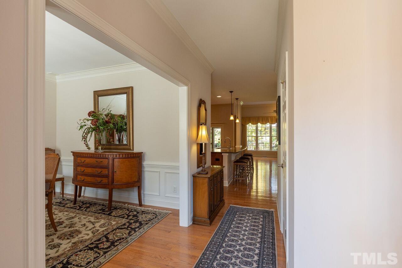 7382 Fontana Ridge Lane Raleigh, NC 27613 - Photo 4 of 30 a view of a hallway view with wooden floor and a rug