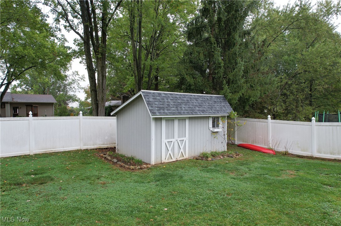 3123 Clearview Road Ravenna, OH 44266 - Photo 5 of 44 View of shed featuring a fenced backyard and view of scattered trees
