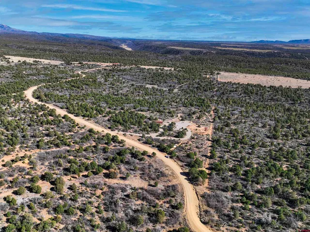a view of a large body of water with a building in the background