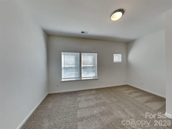 a white toilet sitting next to a bath tub