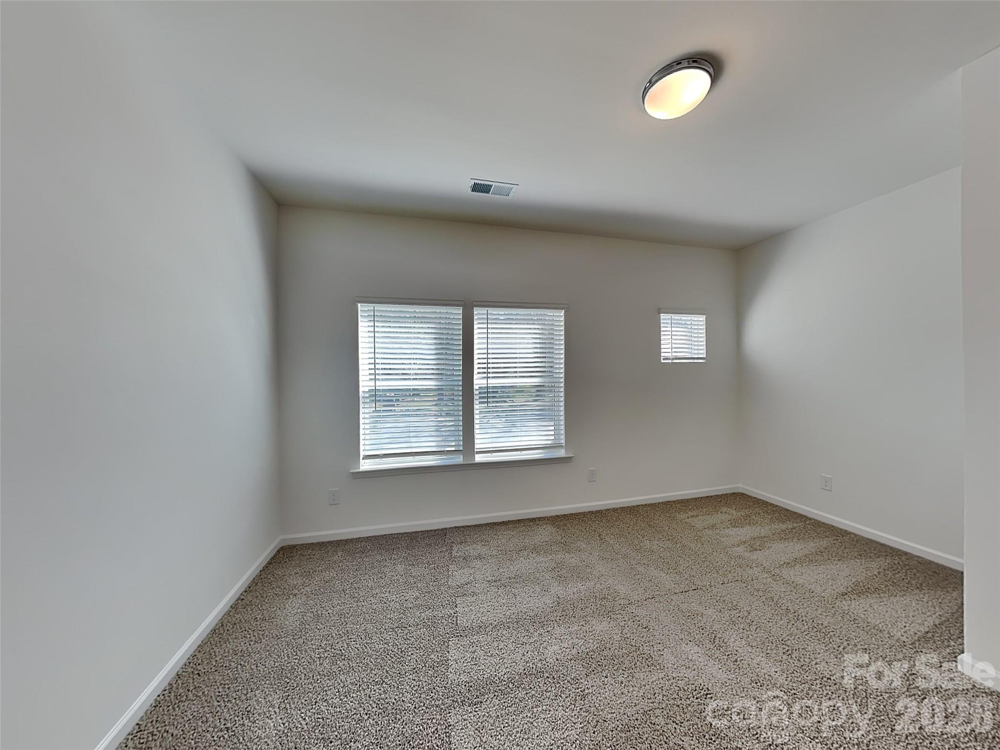 481 Hager Lake Road Mooresville, NC 28115 - Photo 13 of 23 an empty room with a window