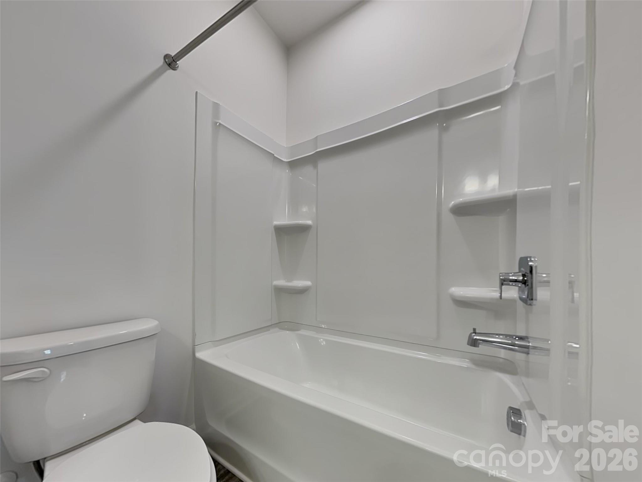 481 Hager Lake Road Mooresville, NC 28115 - Photo 14 of 23 a white toilet sitting next to a bath tub