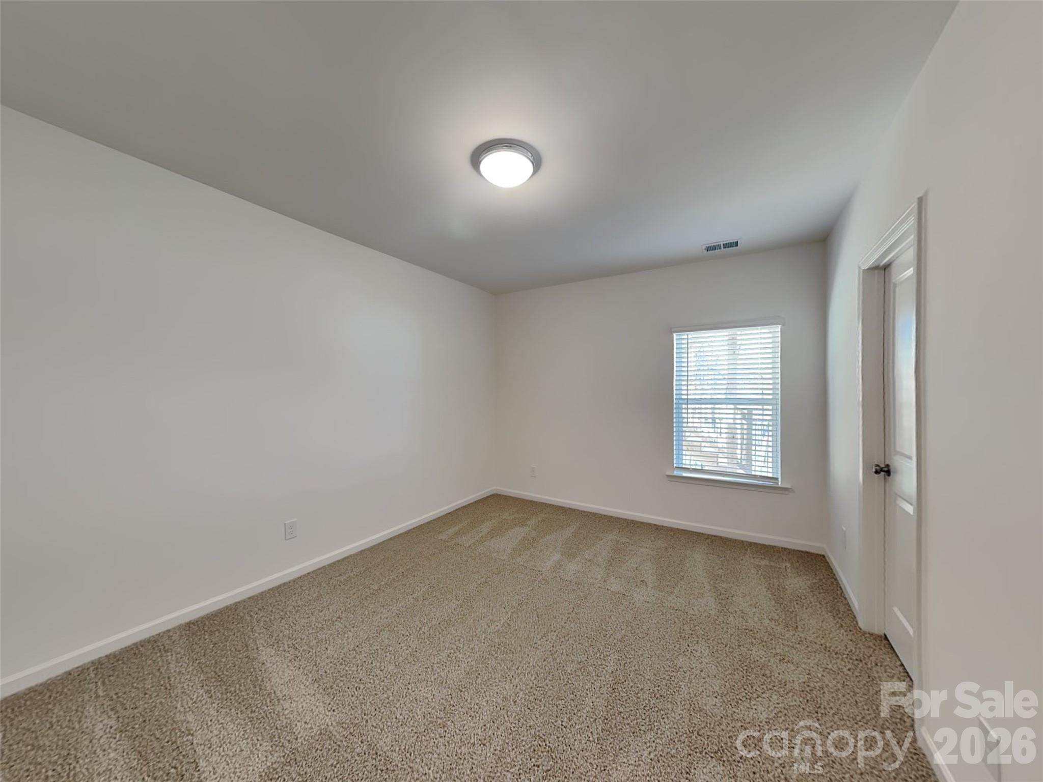481 Hager Lake Road Mooresville, NC 28115 - Photo 16 of 23 an empty room with windows