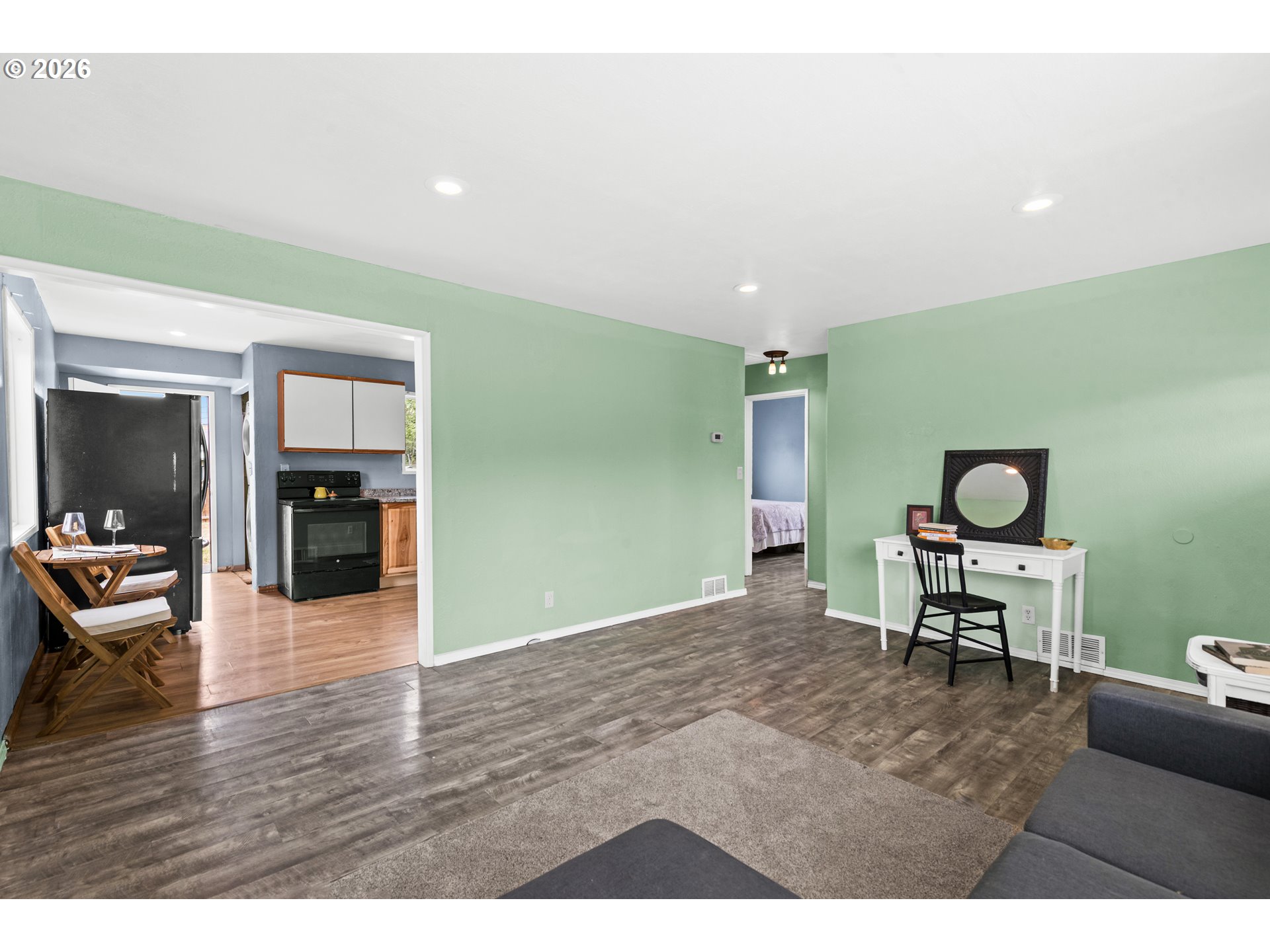 3009 Southwest Isaac Avenue Pendleton, OR 97801 - Photo 14 of 28 a living room with furniture and a wooden floor