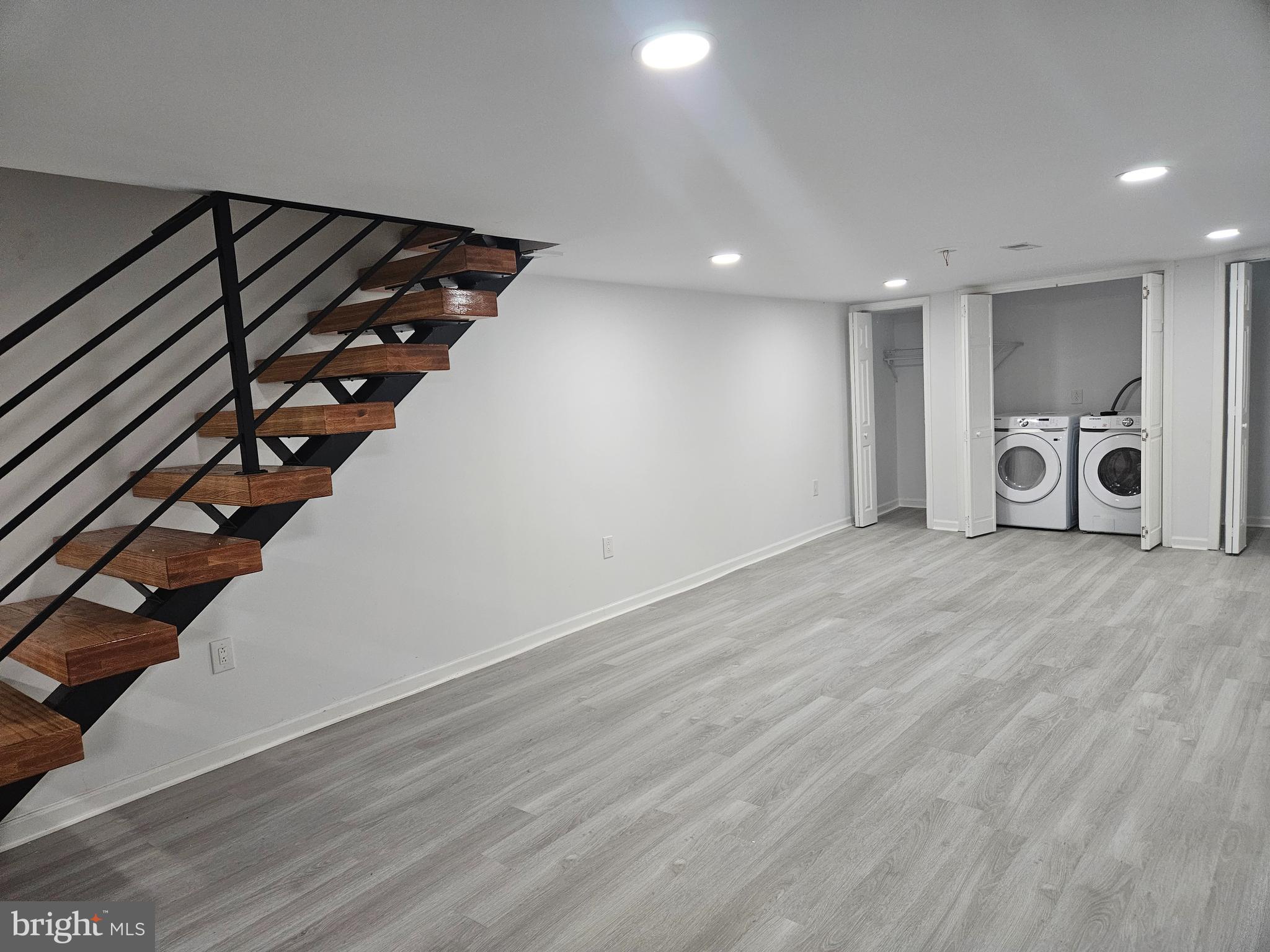 83 West Sharpnack Street Philadelphia, PA 19119 - Photo 18 of 38 Finished basement w/washer & dryer laundry area