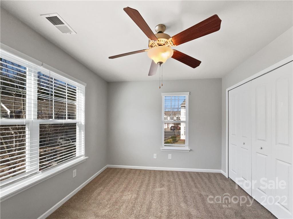 1417 Harpers Inlet Drive Clover, SC 29710 - Photo 18 of 20 a view of an empty room with a window and wooden floor