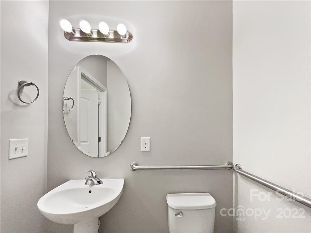 1417 Harpers Inlet Drive Clover, SC 29710 - Photo 8 of 20 a bathroom with a sink mirror and toilet