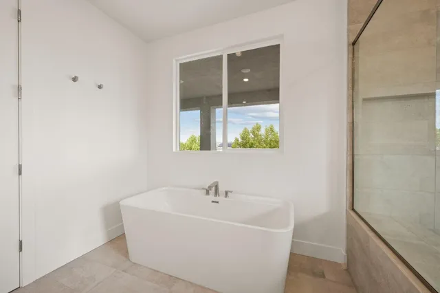 a white bath tub sitting in a bathroom