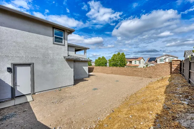 a view of a backyard of the house
