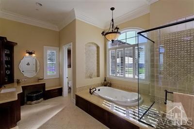 3402 Deep Waters Court Simi Valley, CA 93065 - Photo 16 of 48 a bathroom with a granite countertop tub shower and mirror