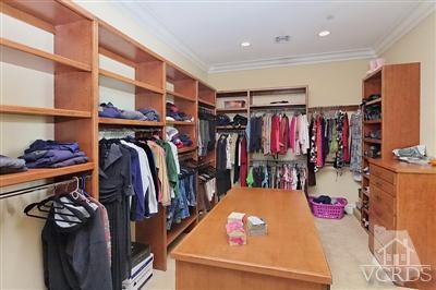 3402 Deep Waters Court Simi Valley, CA 93065 - Photo 17 of 48 a view of walk in closet with clothes and shoes