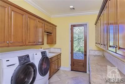 3402 Deep Waters Court Simi Valley, CA 93065 - Photo 22 of 48 a utility room with dryer and washer
