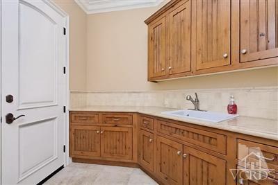 3402 Deep Waters Court Simi Valley, CA 93065 - Photo 23 of 48 a kitchen with stainless steel appliances granite countertop a sink and dishwasher with cabinets